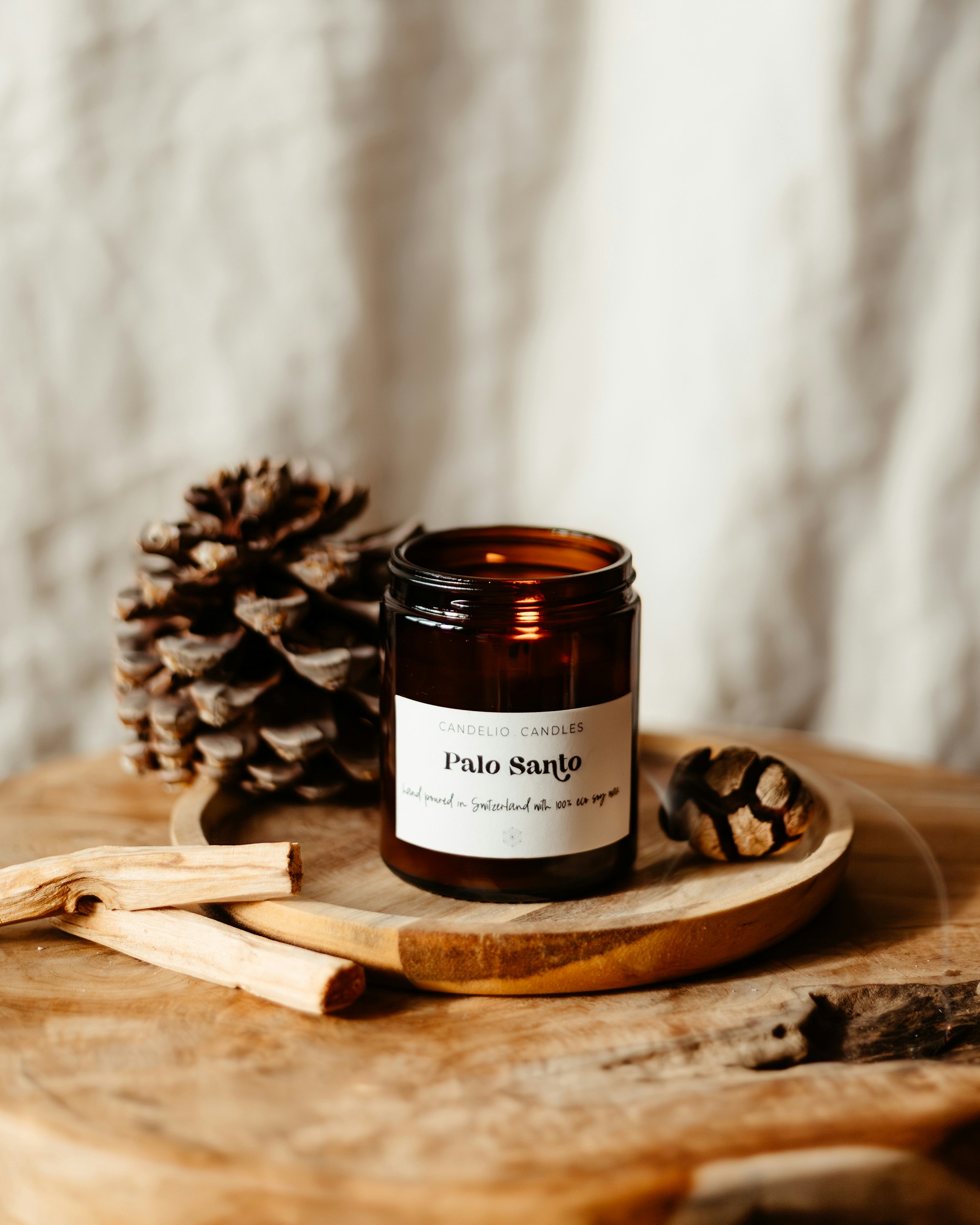 A candle sitting on top of a wooden table
