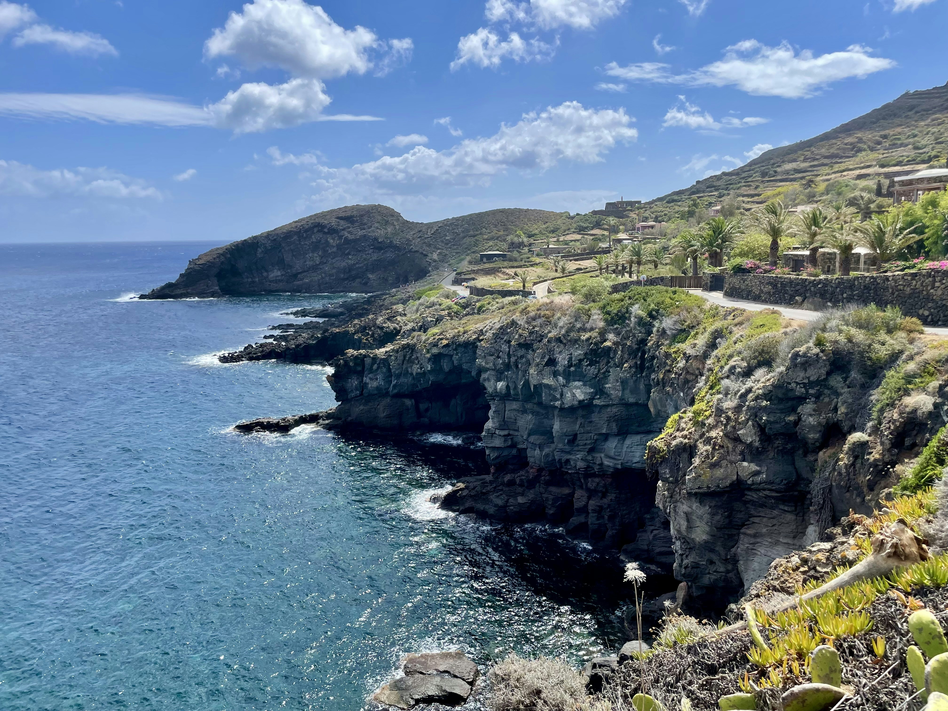 A scenic view of the ocean from a cliff