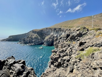 A view of the ocean from a rocky cliff
