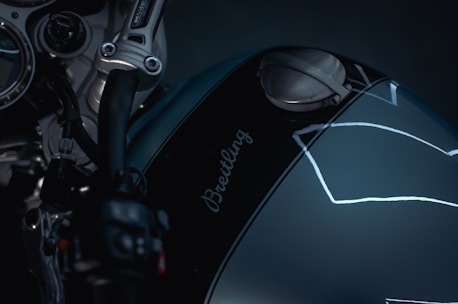 A close up of a motorcycle with a helmet on