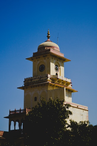 A tall tower with a clock on the top of it