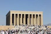A large group of people standing in front of a building