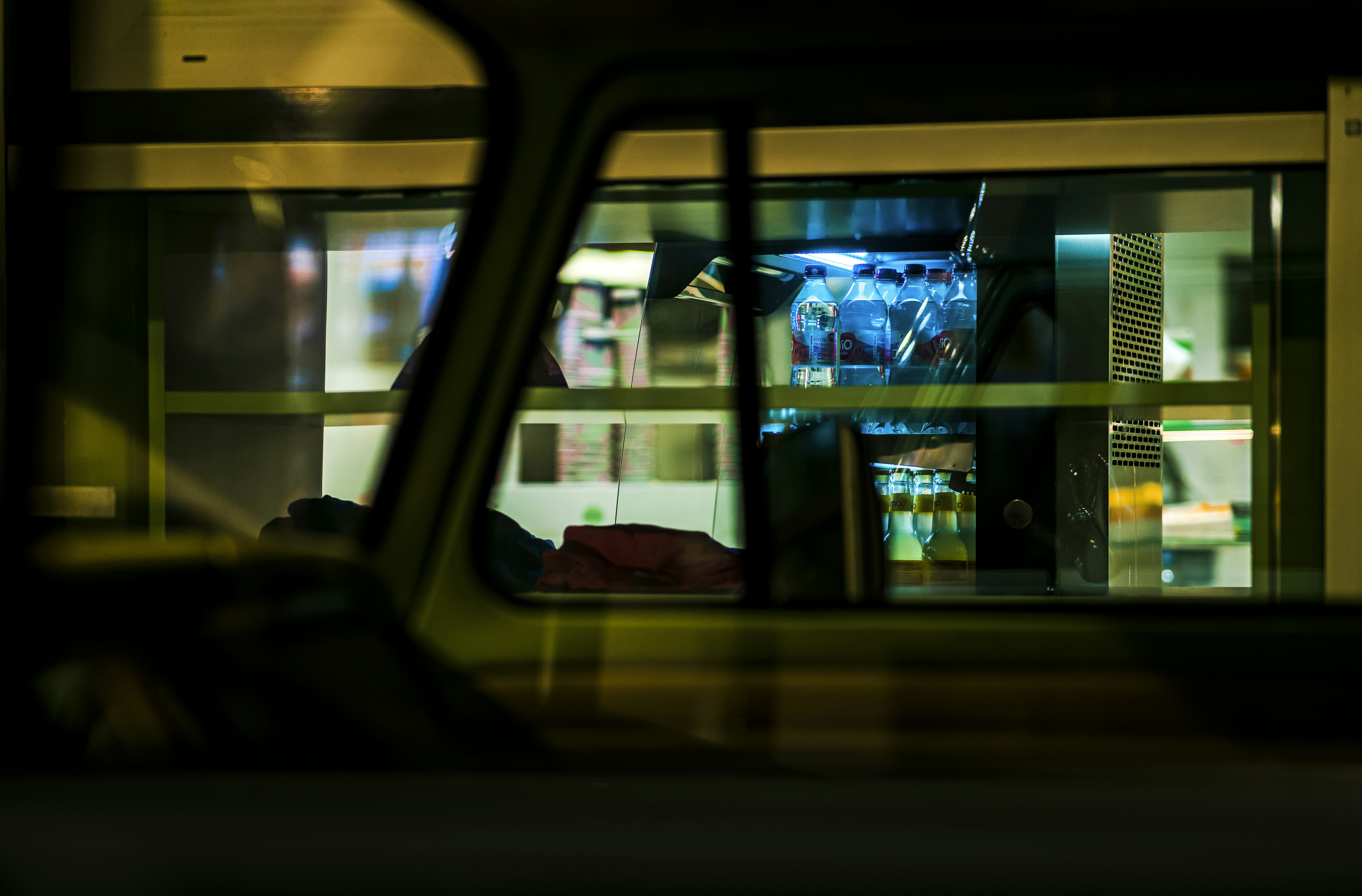A view from inside a car of a store at night