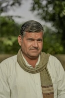 A man with a scarf around his neck