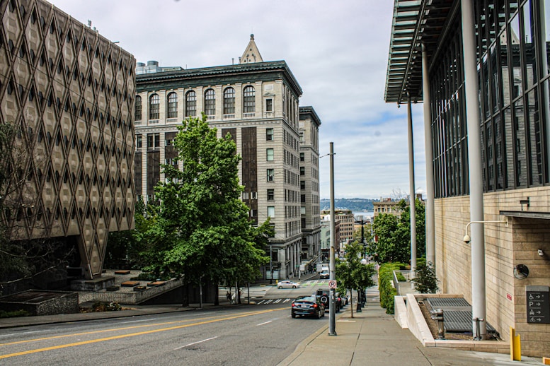 A city street lined with tall buildings