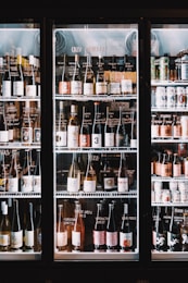 A refrigerator filled with lots of bottles of wine