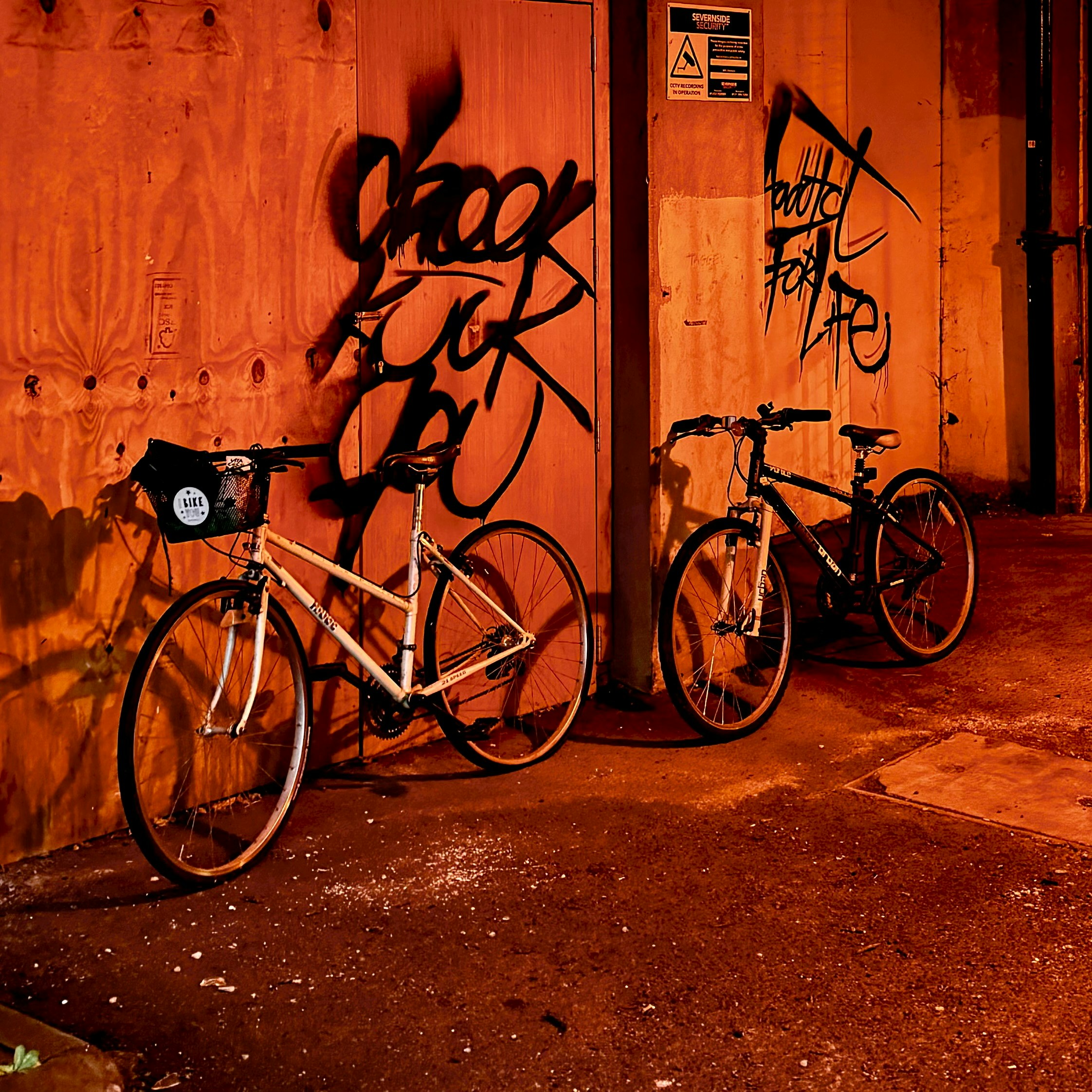 A couple of bikes parked next to each other