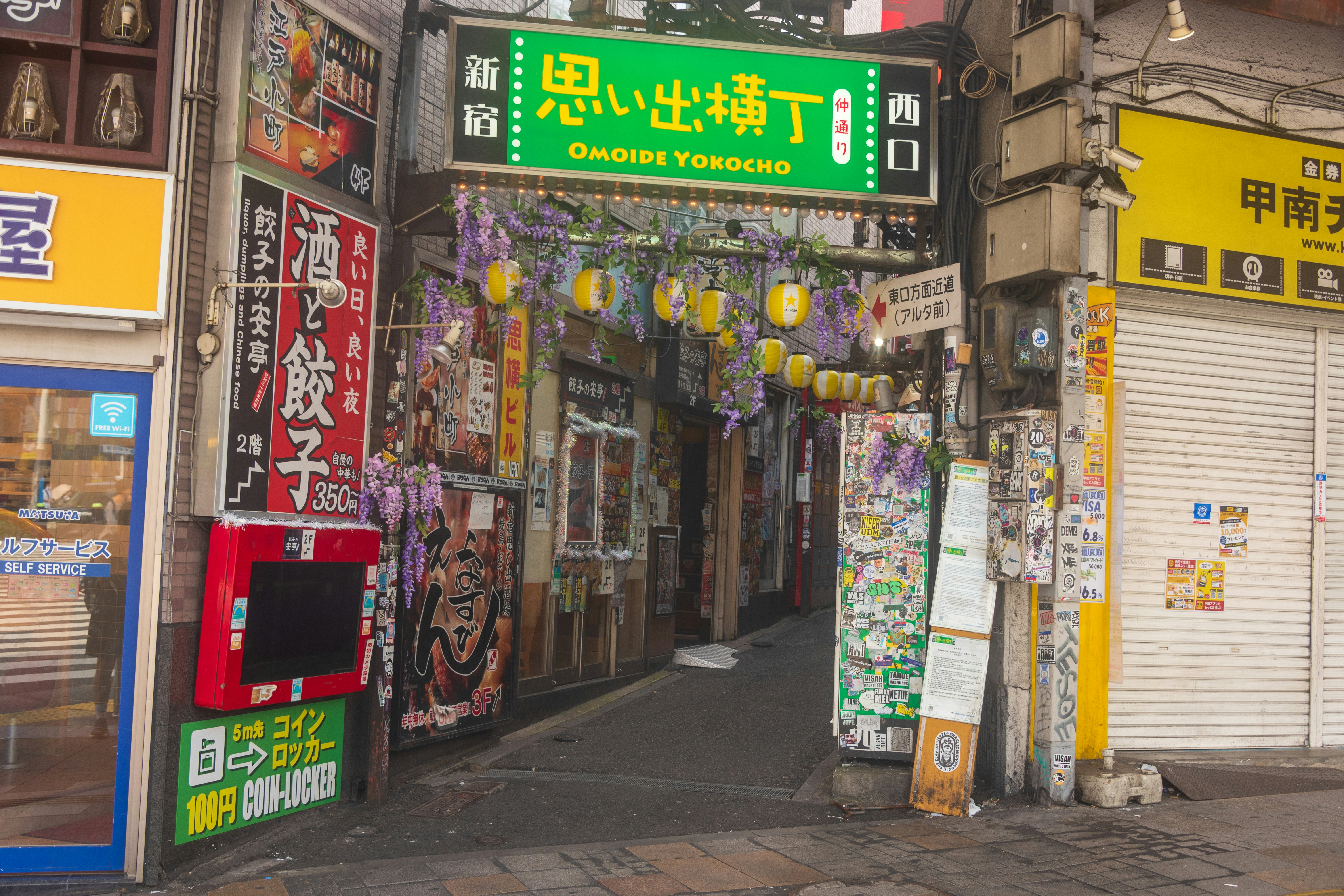 A city street with a bunch of stores on the side of it