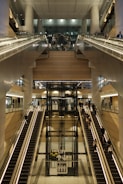 A train station with escalators and stairs