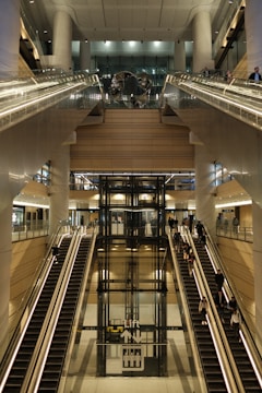 A train station with escalators and stairs
