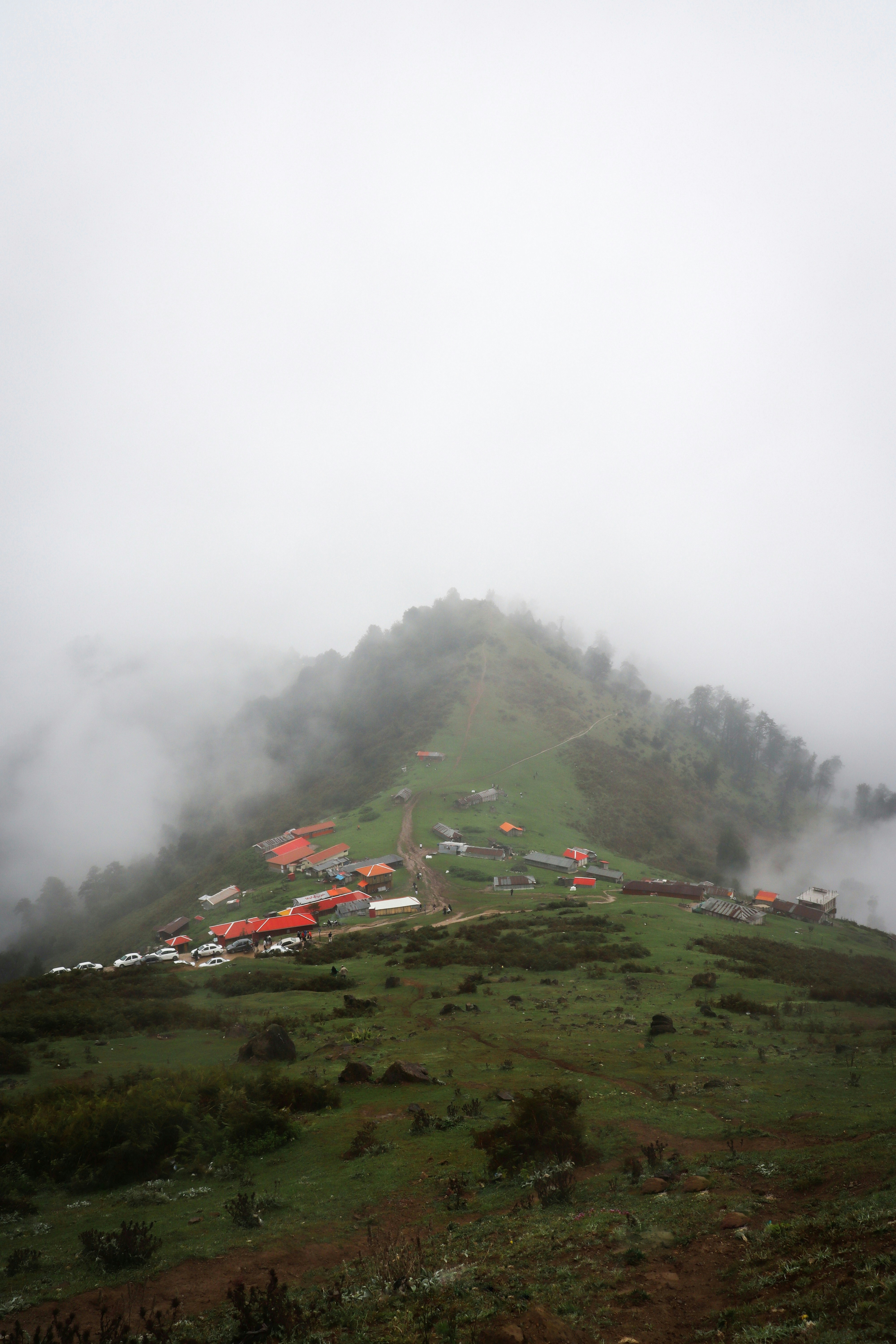 A hill covered in fog and low lying clouds photo – Free Iran Image on ...