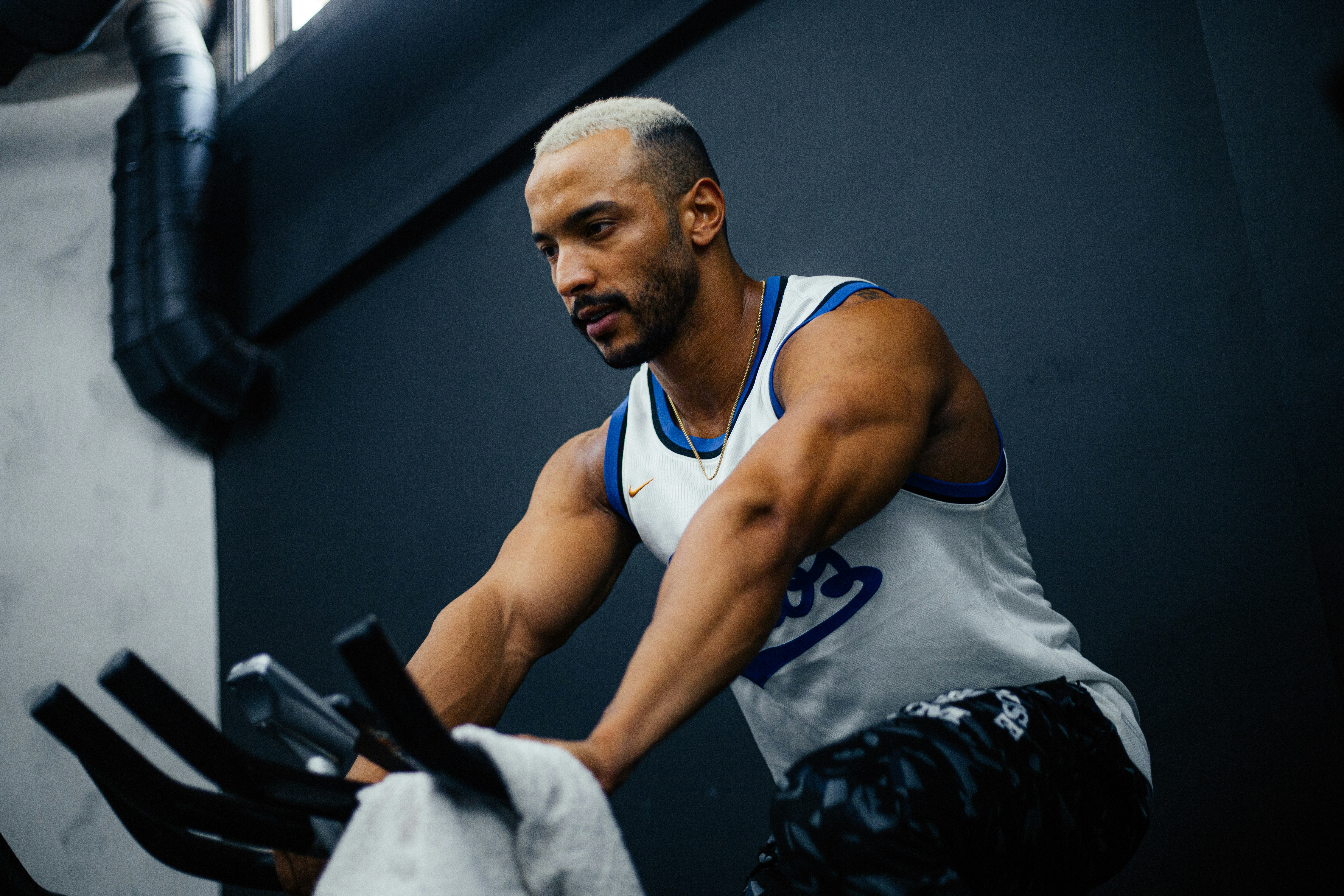 A man on a stationary bike in a gym