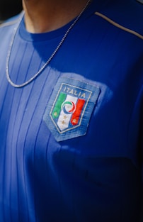 A close up of a person wearing a blue shirt