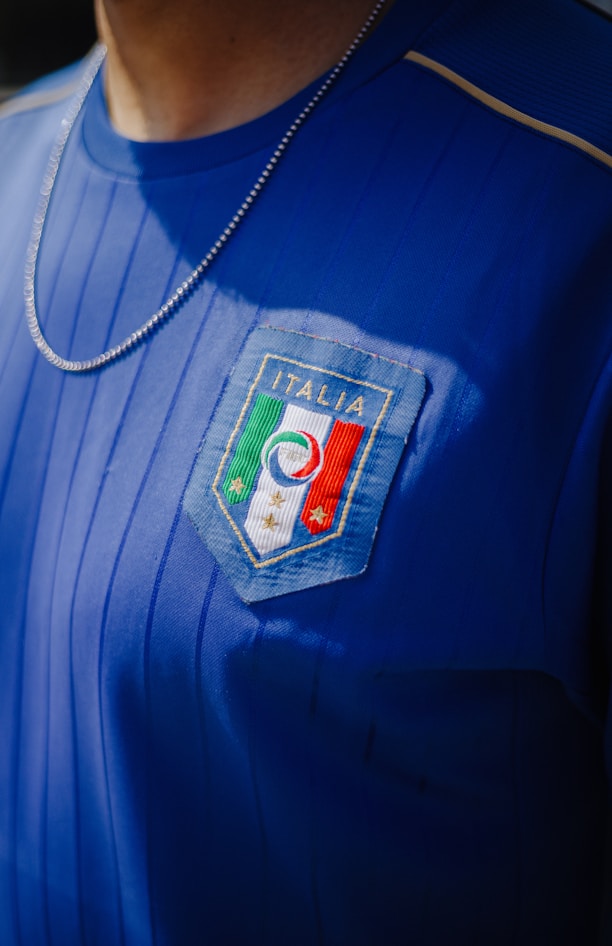 A close up of a person wearing a blue shirt