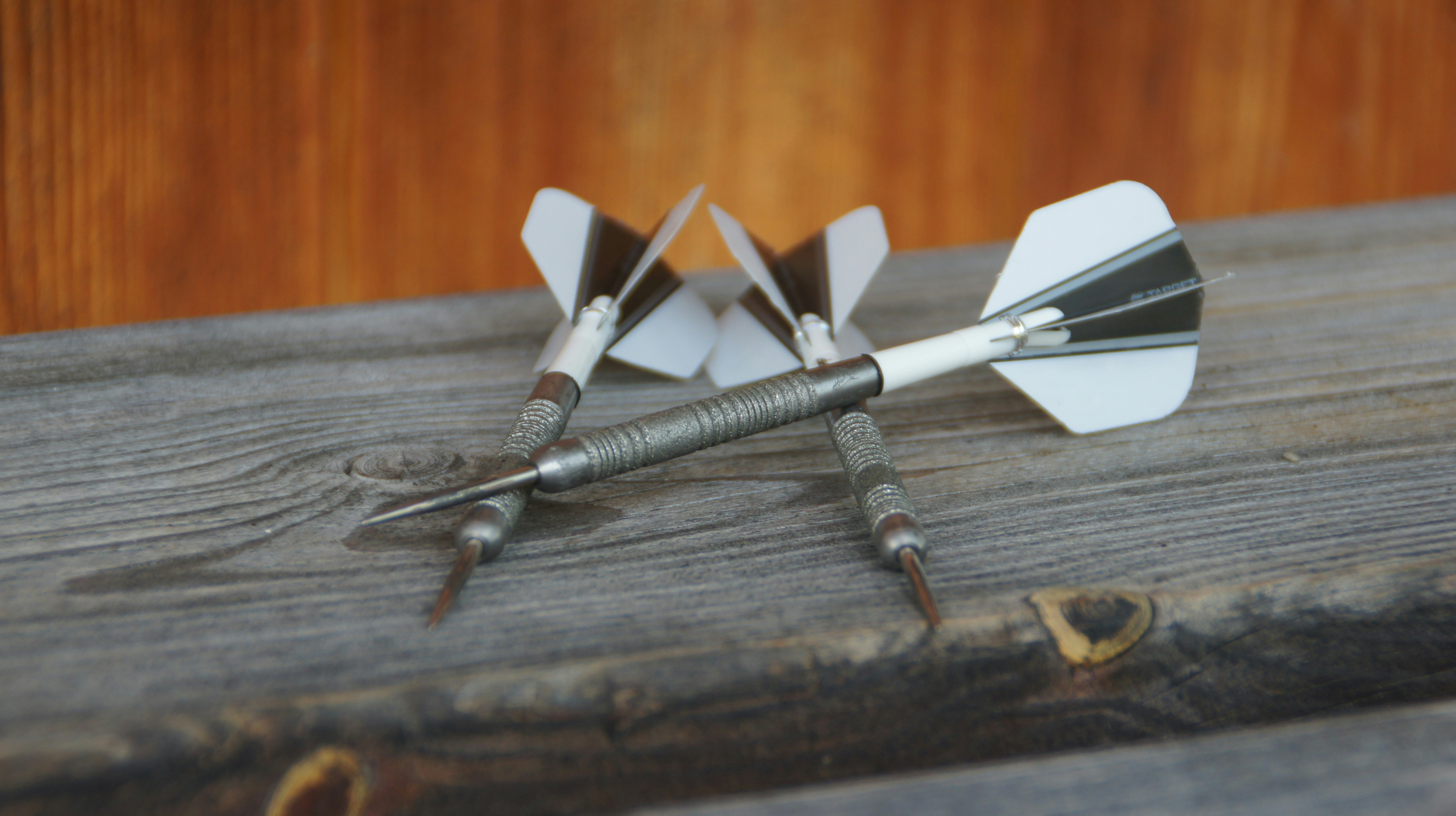 A close up of a metal object on a wooden surface