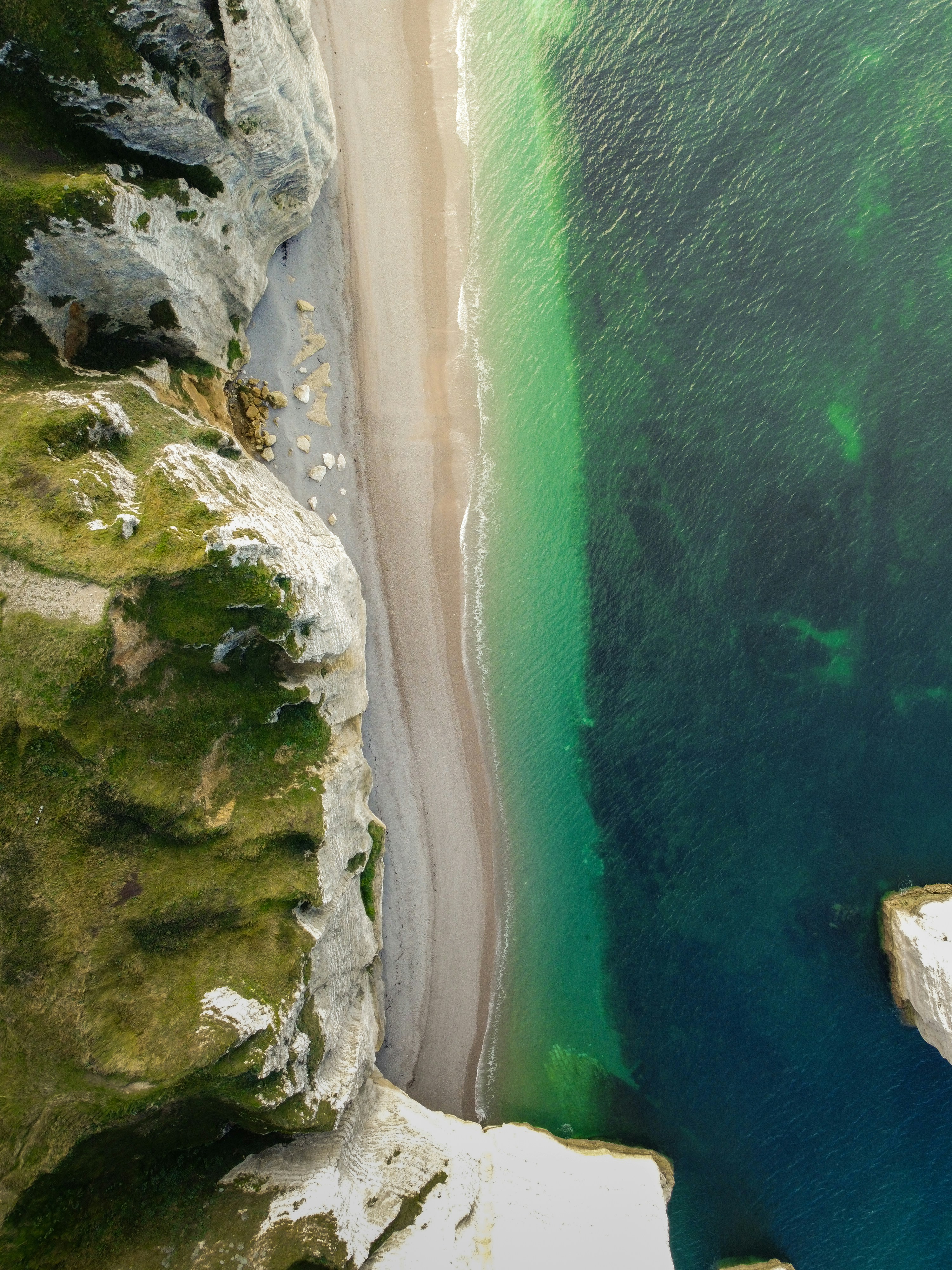 An aerial view of a beach and a body of water