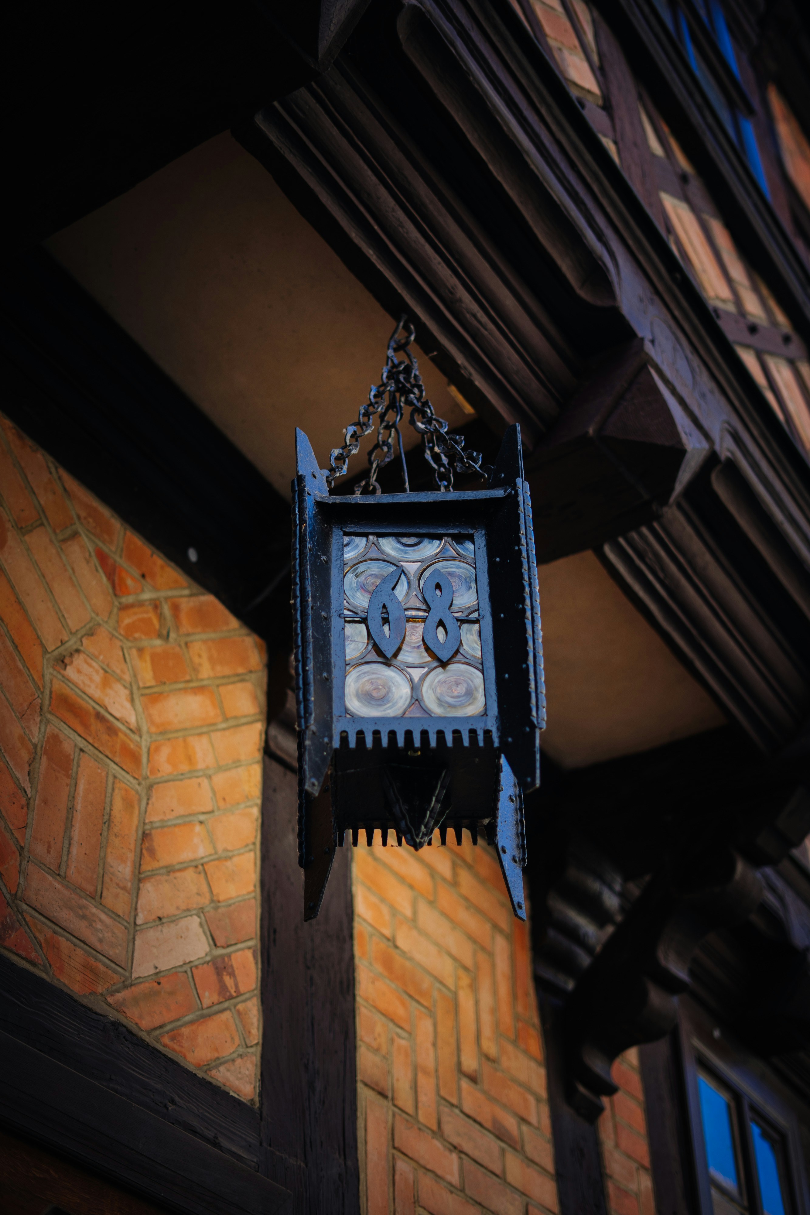 A clock hanging from the side of a building