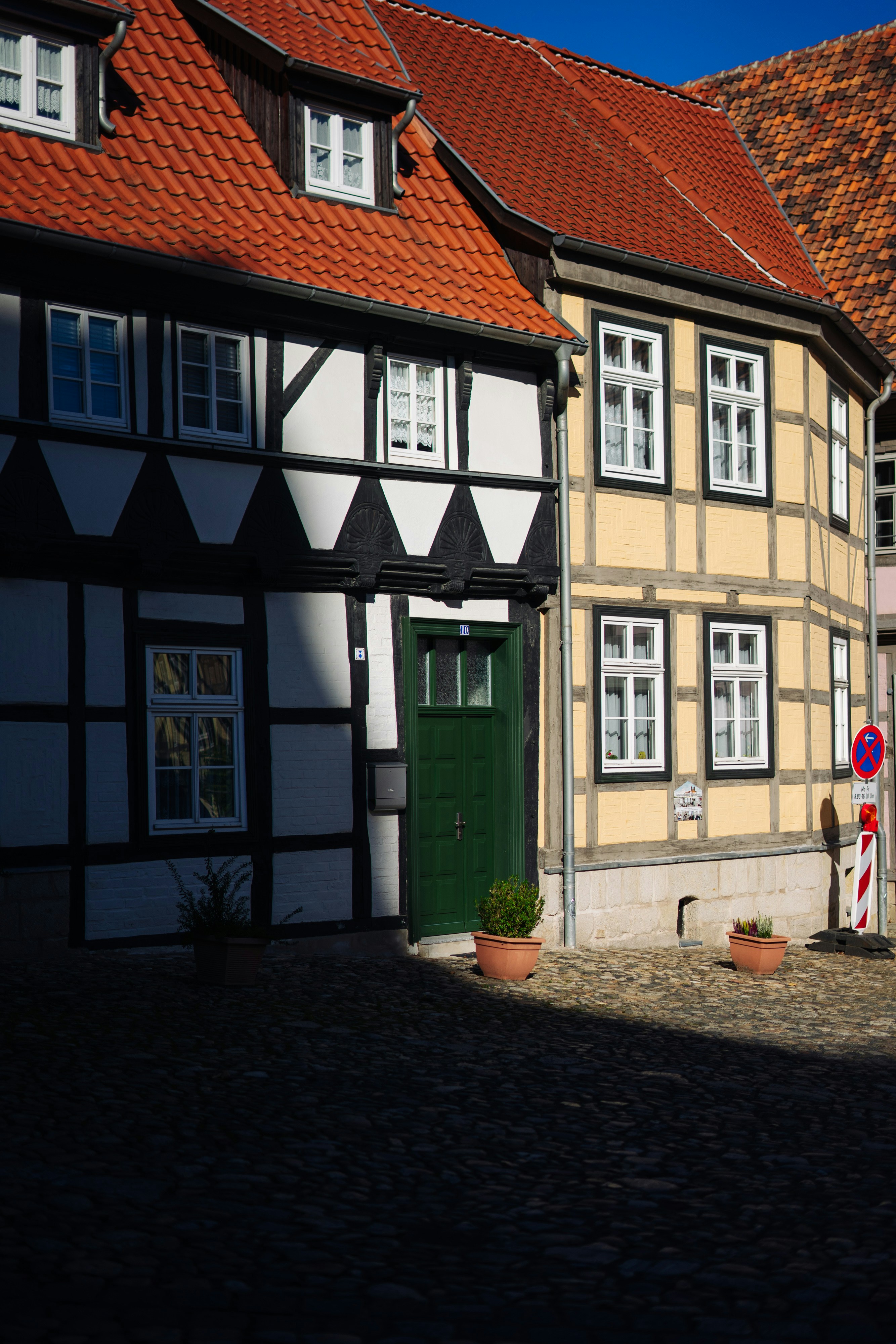 A row of houses with red roof tops