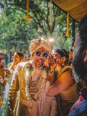 A man and woman in traditional indian garb at a wedding