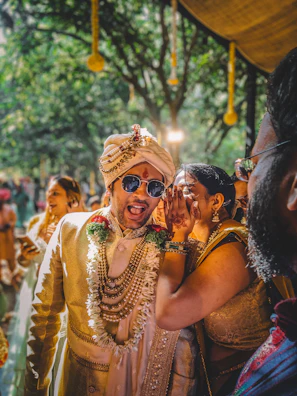 A man and woman in traditional indian garb at a wedding