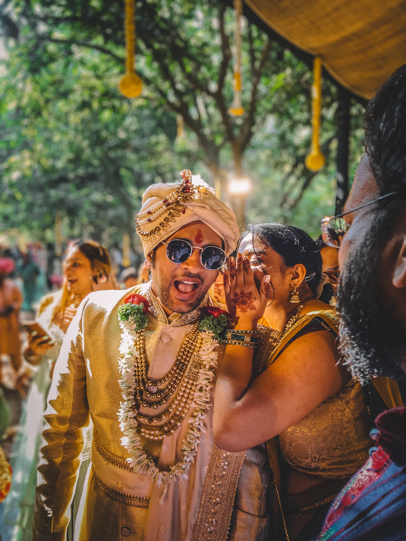 A couple in traditional Indian wedding attire at their ceremony
