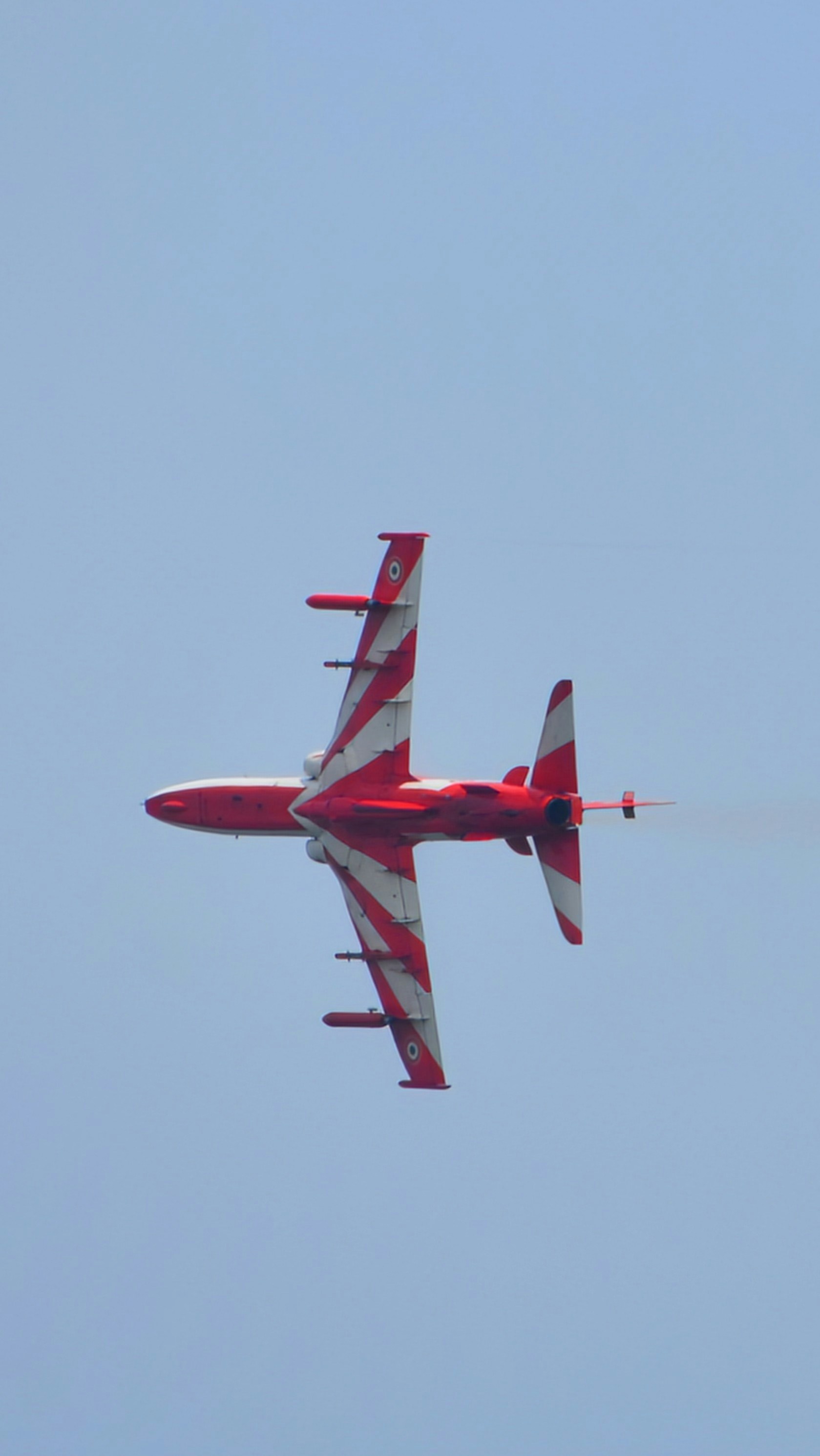 A red and white plane flying in the sky photo – Free Image on Unsplash