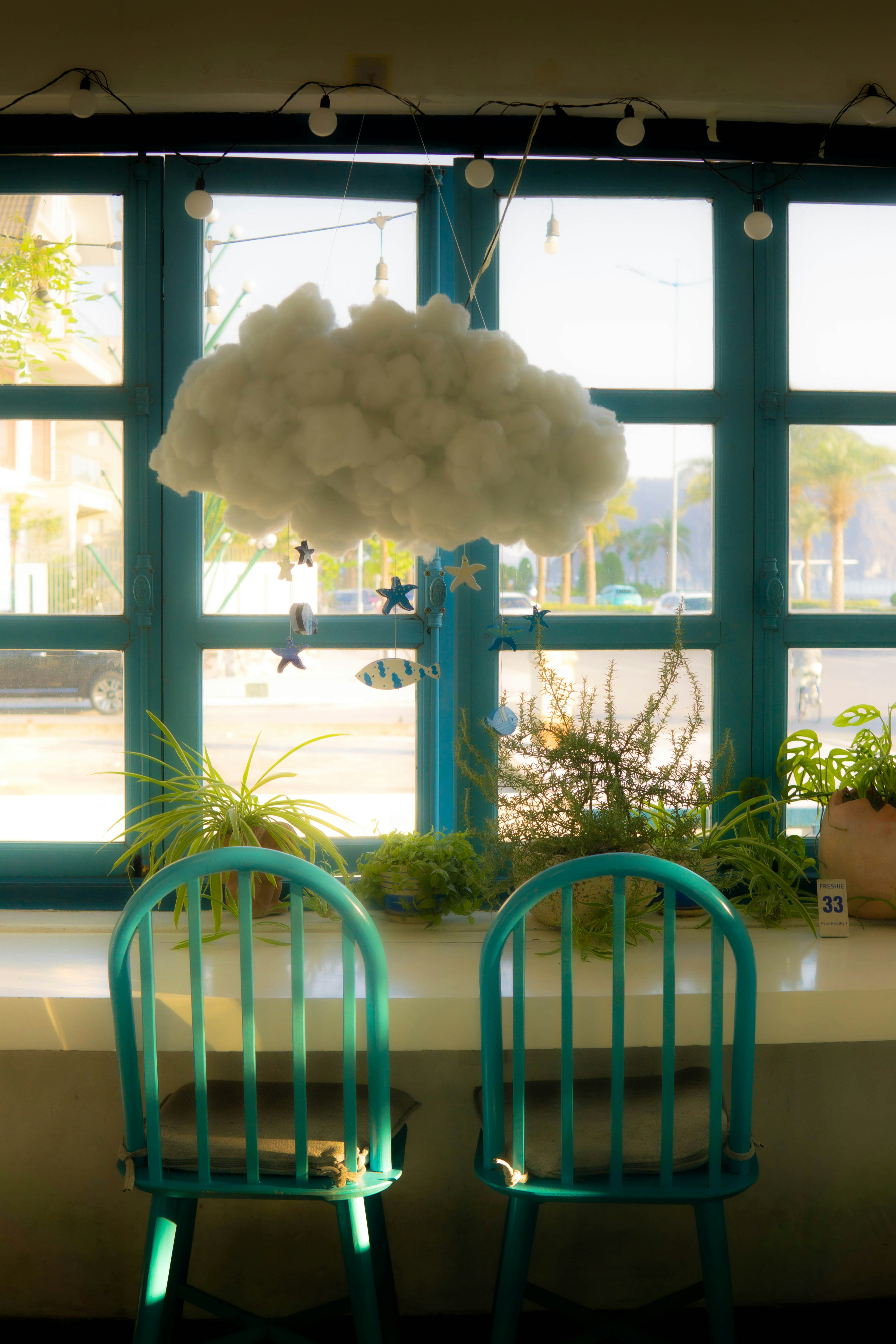 A couple of blue chairs sitting in front of a window