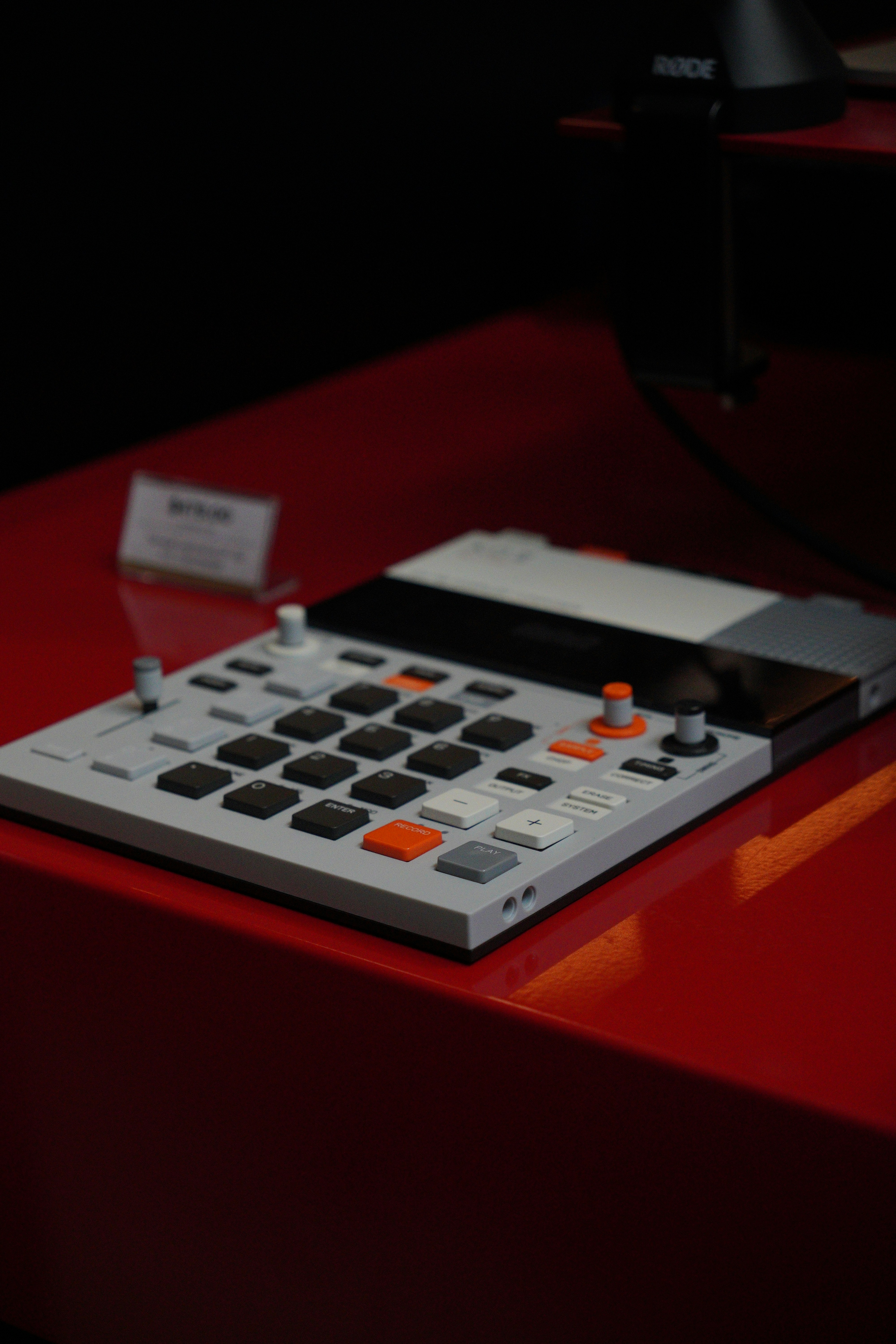 A calculator sitting on top of a red table