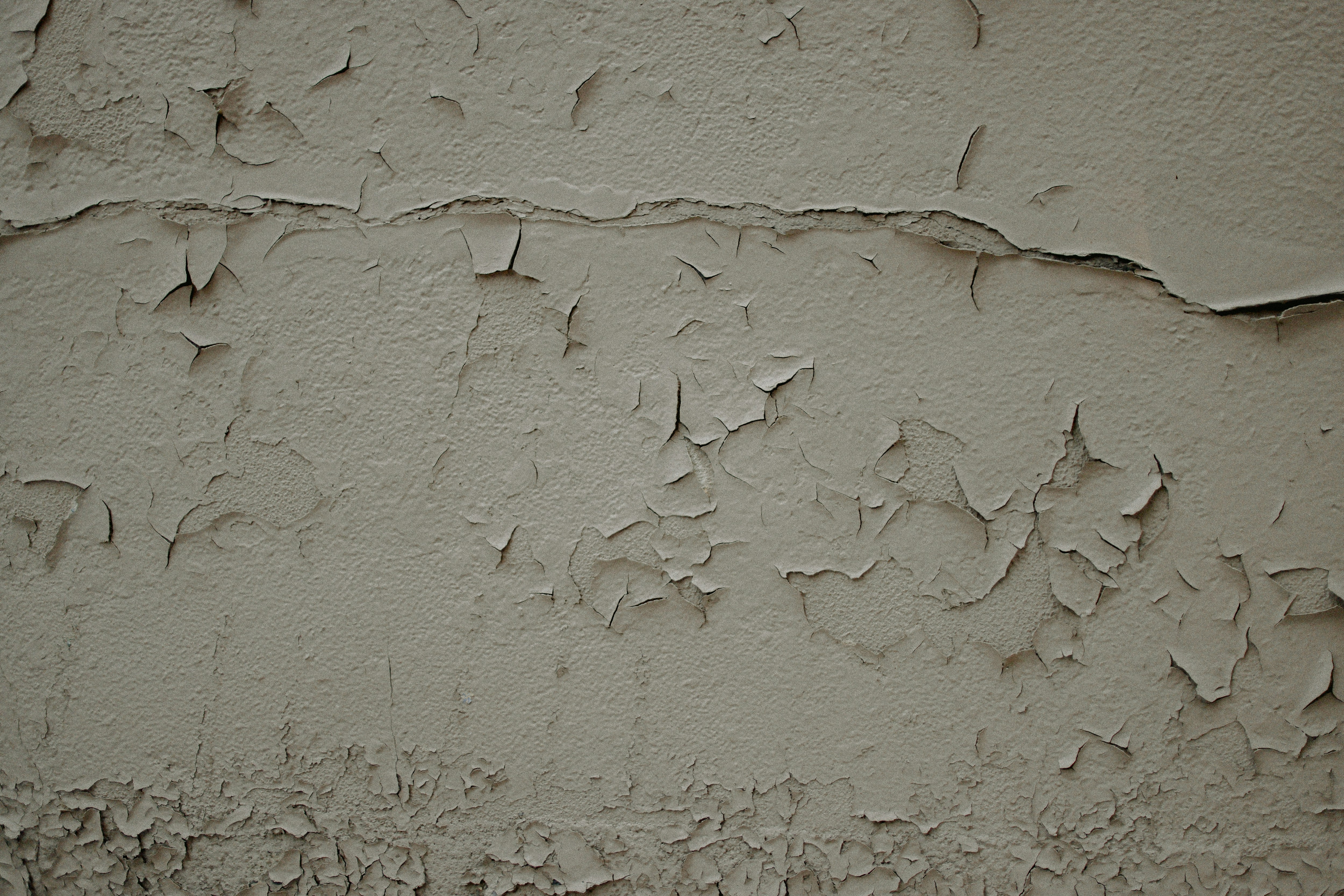A wall that has some cracks in it