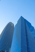 A couple of tall buildings sitting next to each other