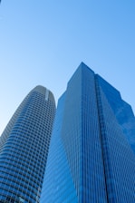 A couple of tall buildings sitting next to each other