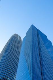 A couple of tall buildings sitting next to each other