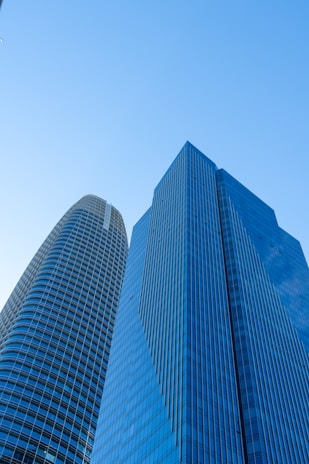 A couple of tall buildings sitting next to each other