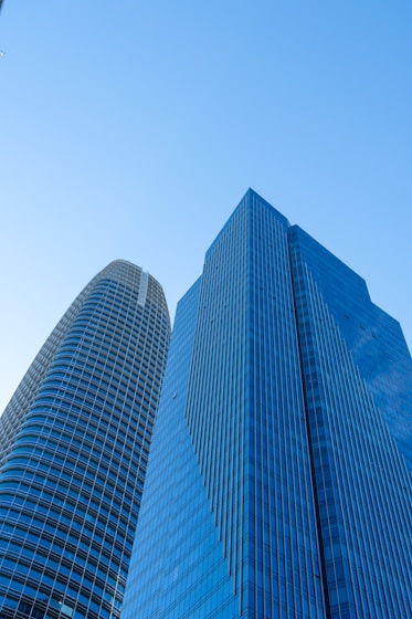 A couple of tall buildings sitting next to each other
