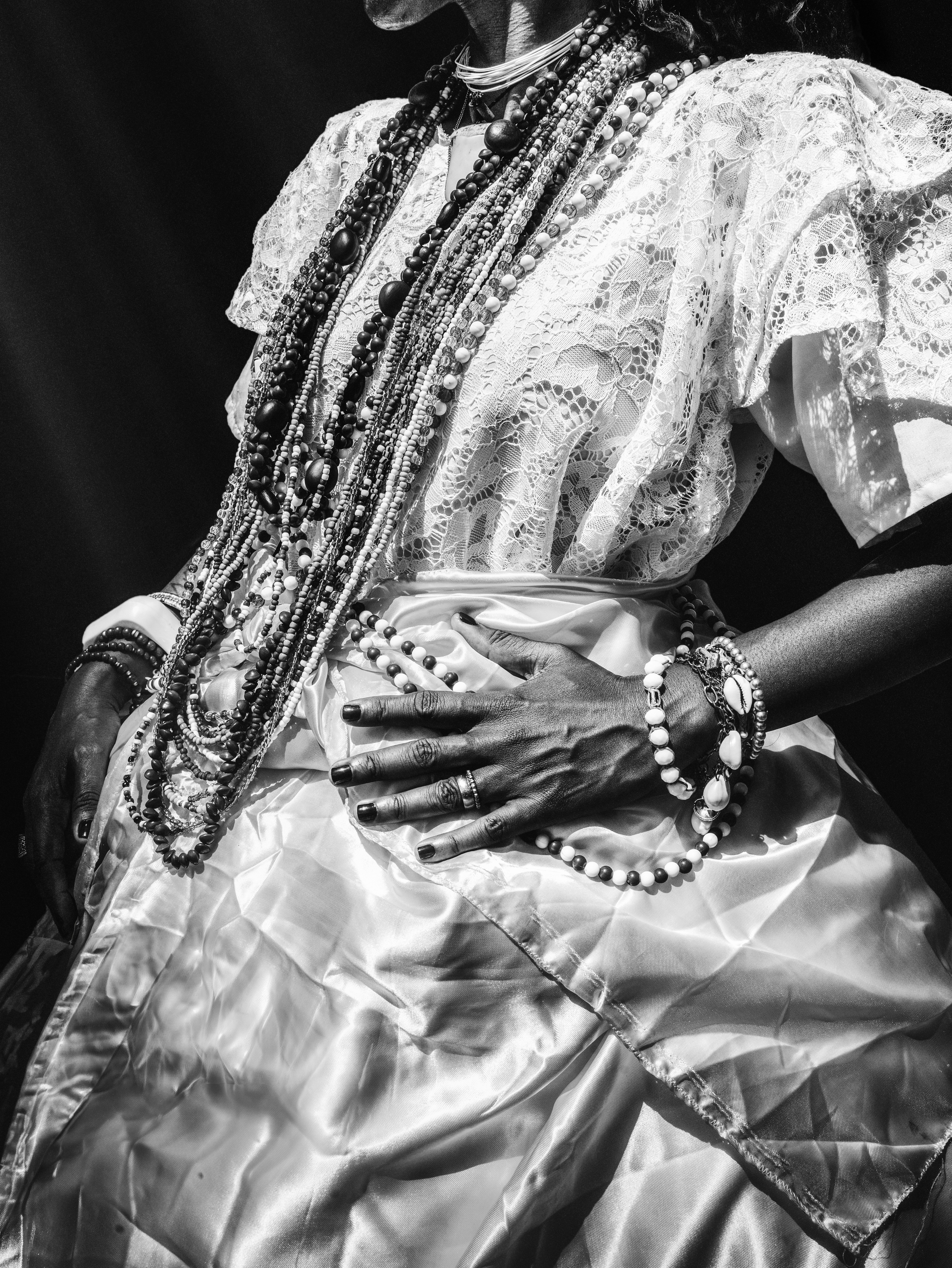 A black and white photo of a woman in a dress