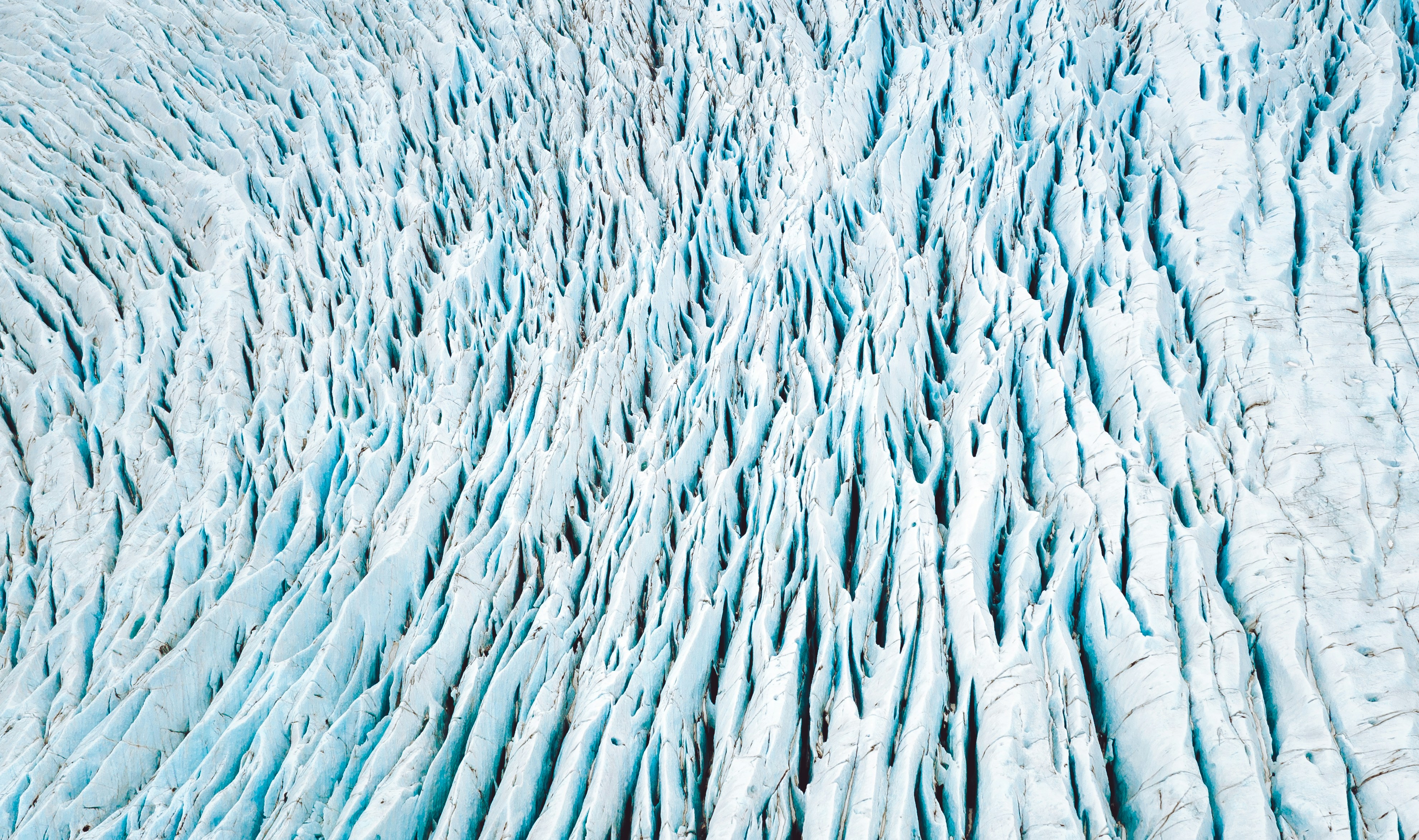 A very large glacier with lots of snow on it