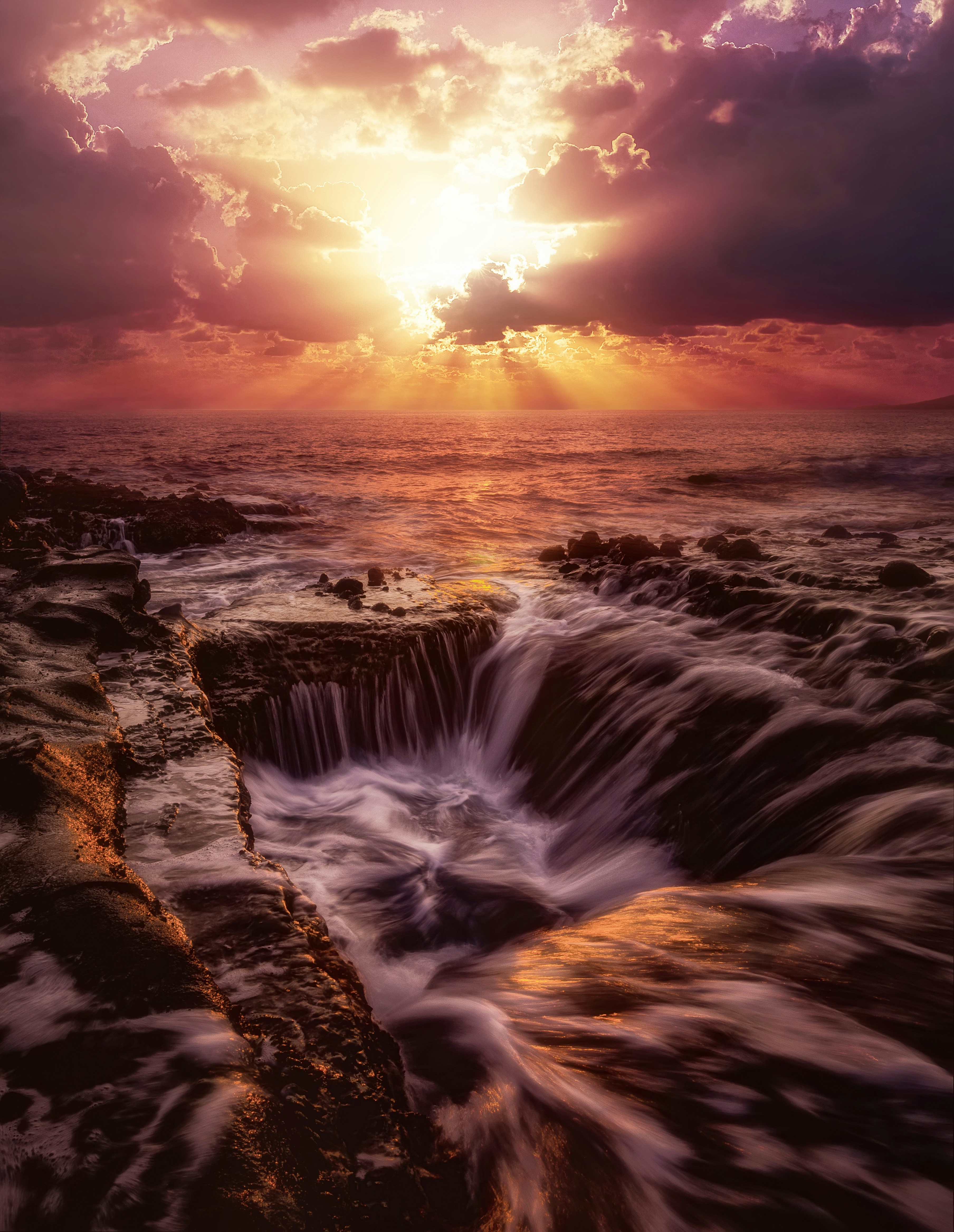 A large body of water surrounded by rocks