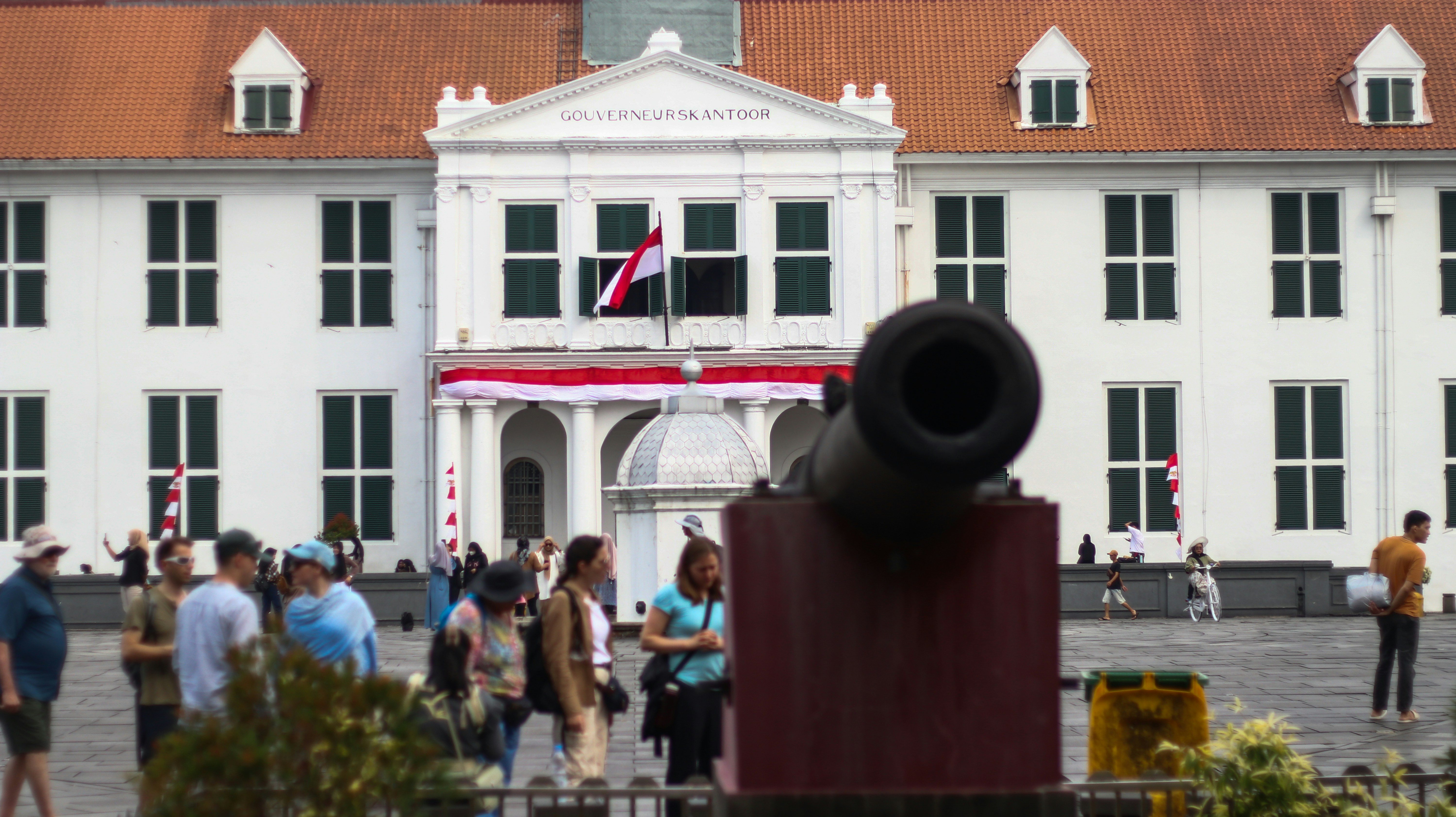 A group of people standing in front of a building