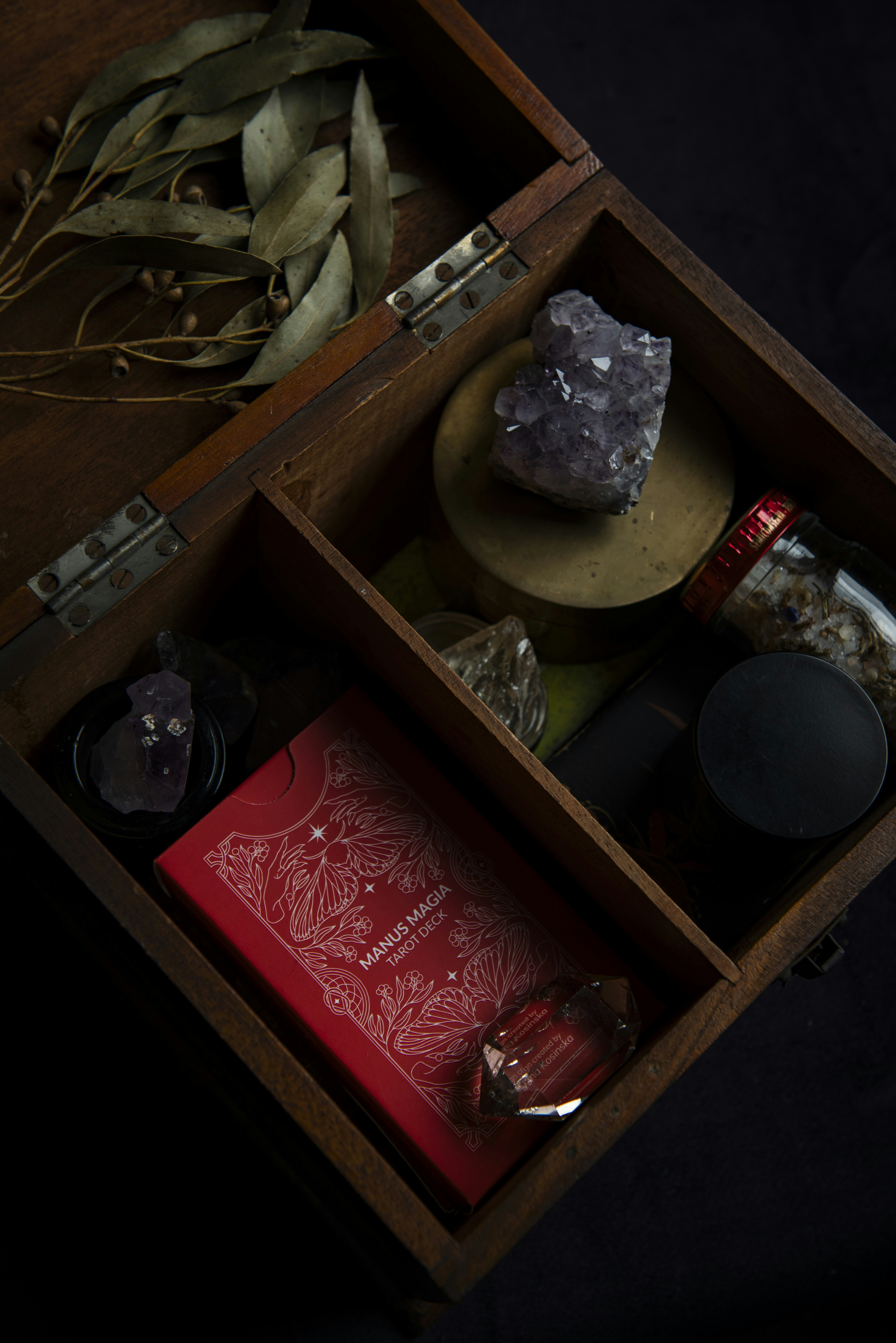 A wooden box filled with different types of items