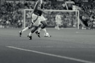 A group of men playing a game of soccer