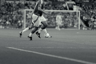 A group of men playing a game of soccer