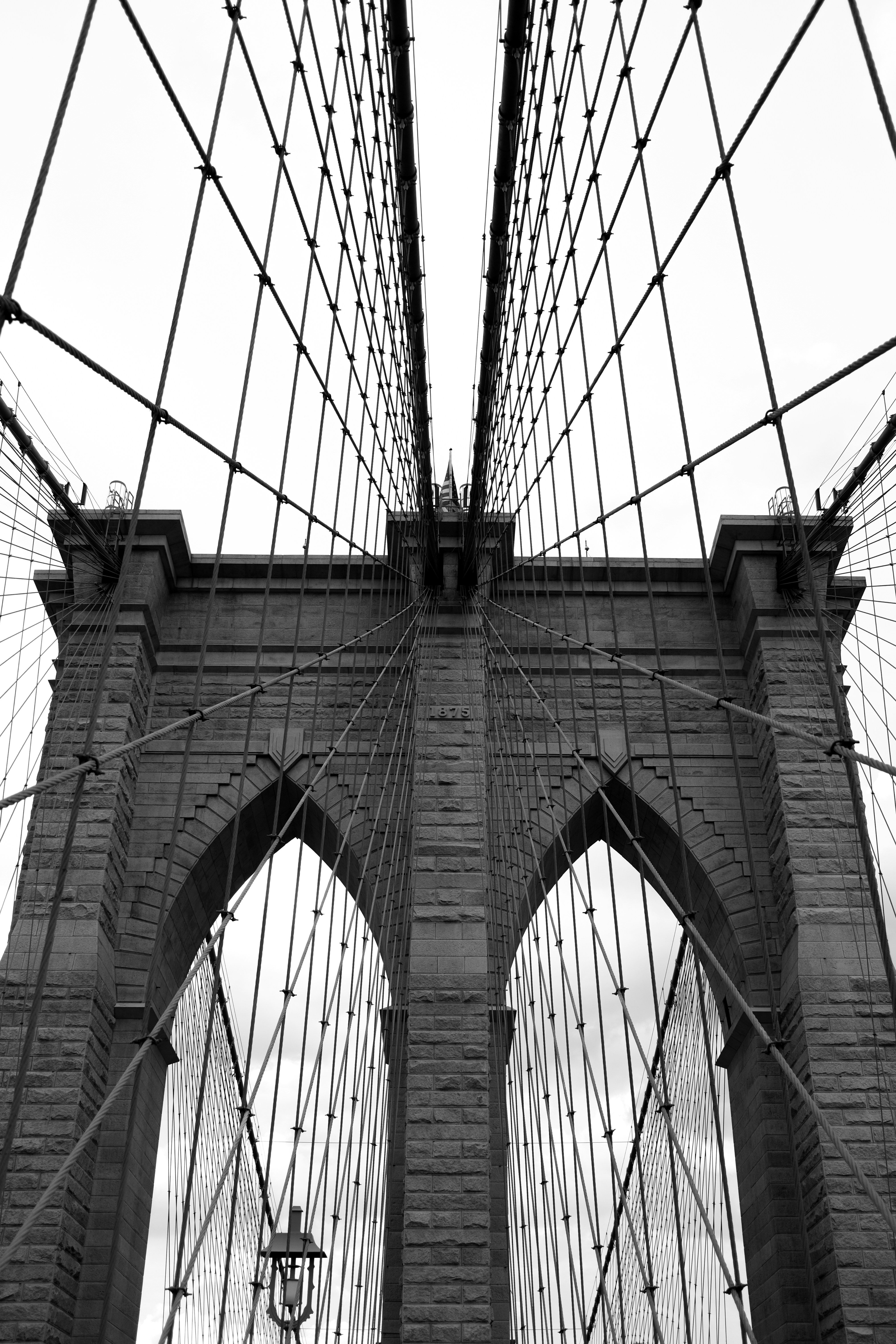 A black and white photo of the brooklyn bridge
