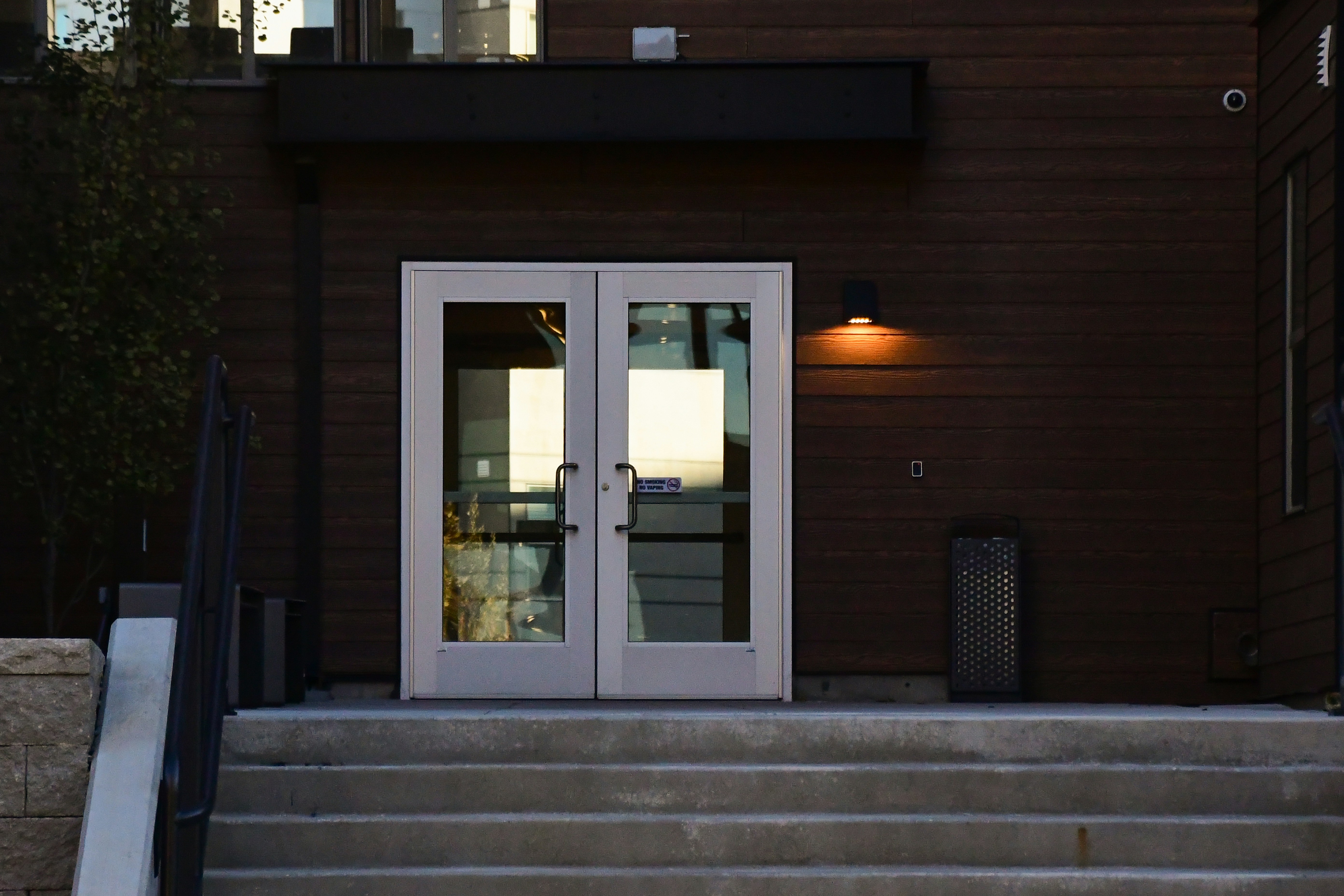 A building with a white door and some steps