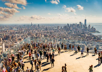 A group of people standing on top of a tall building
