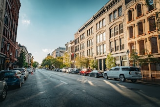 A city street filled with lots of tall buildings