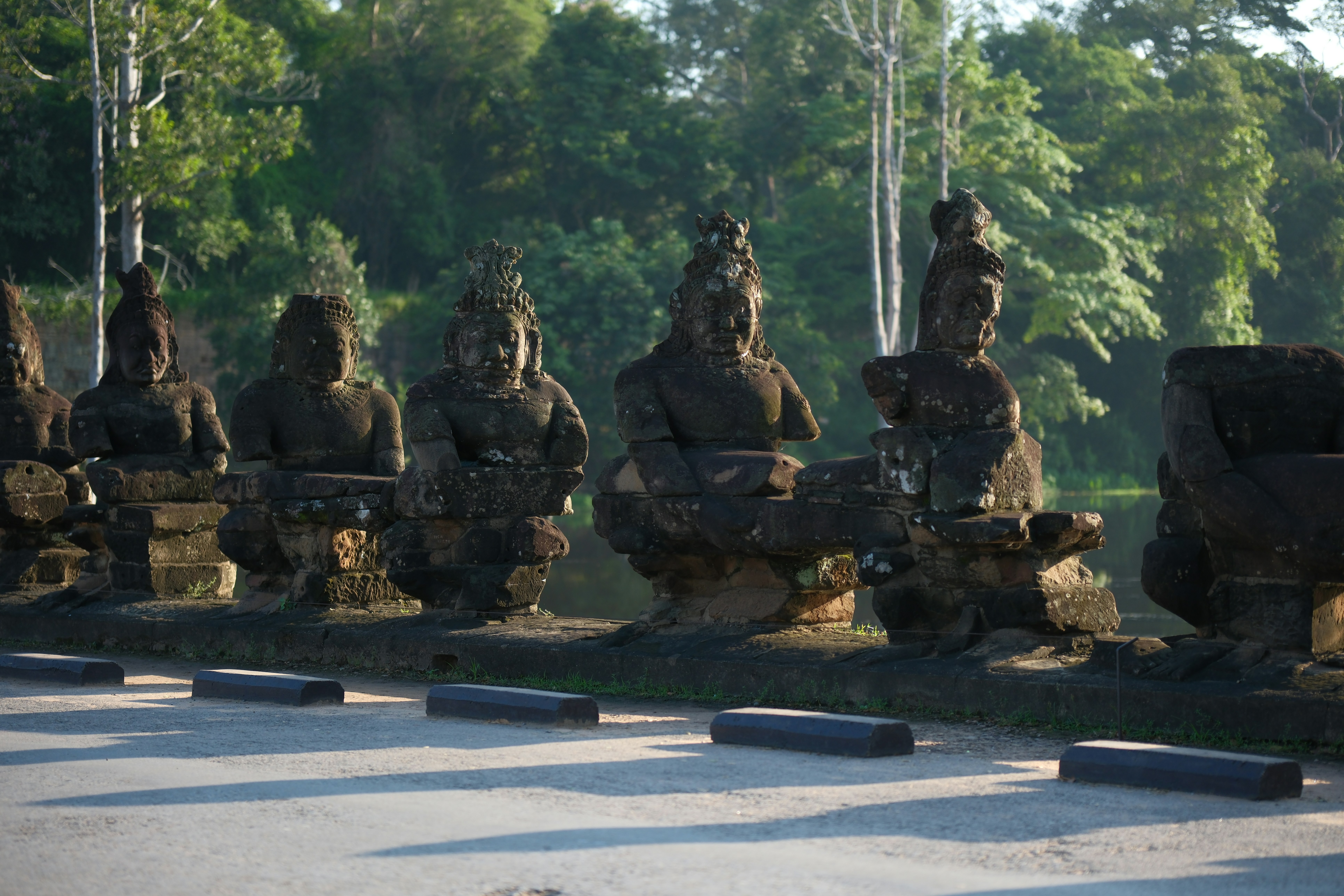 A group of statues sitting on top of a road