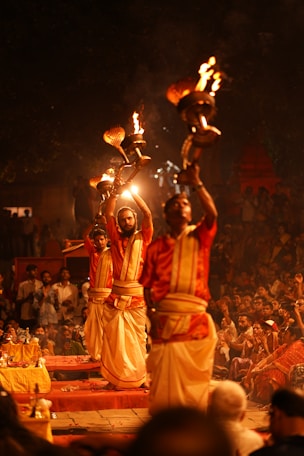 Evening Ganga Aarti at Dashashwamedh Ghat in Varanasi with lamps and chanting on the riverbank