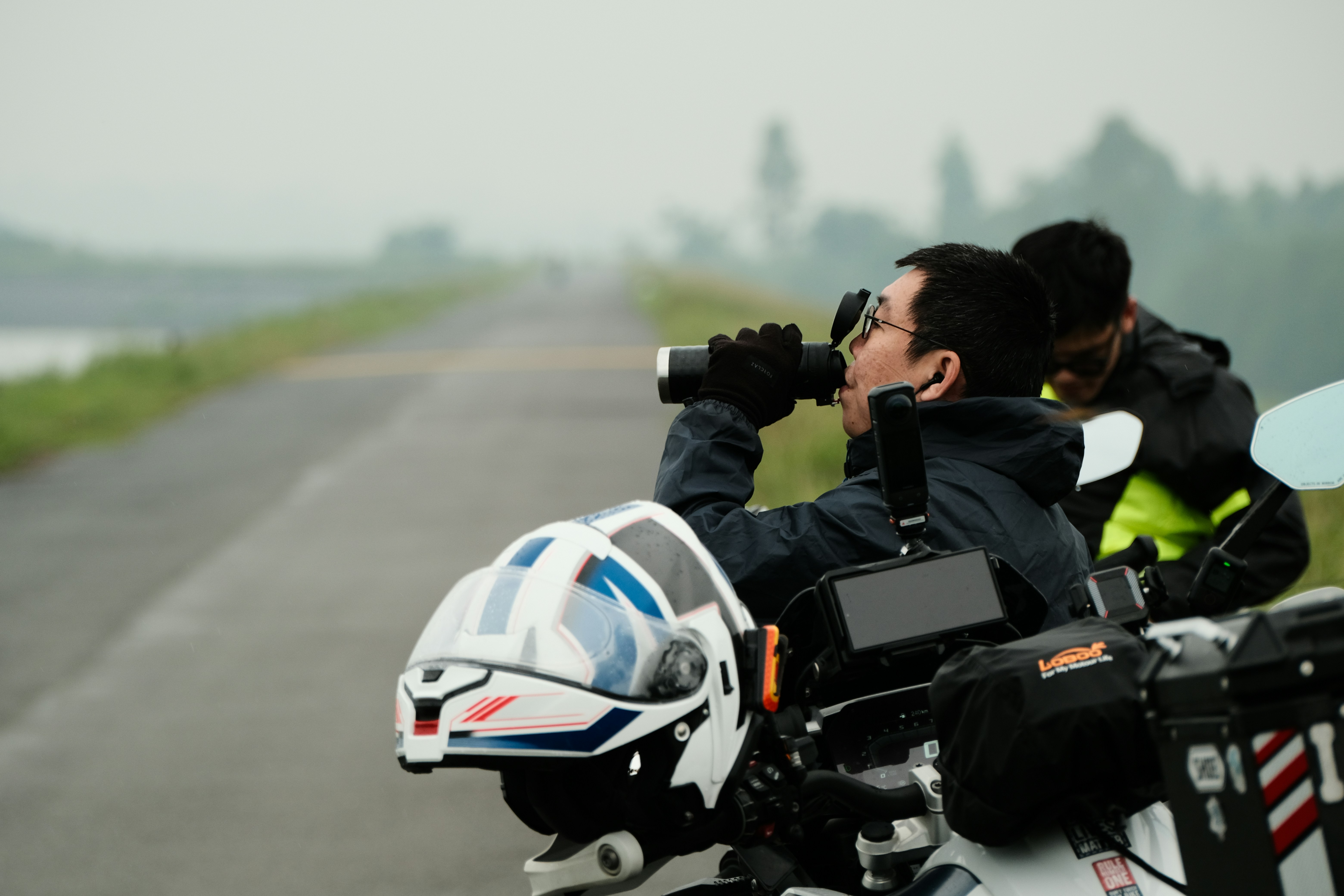rider taking scene photographs