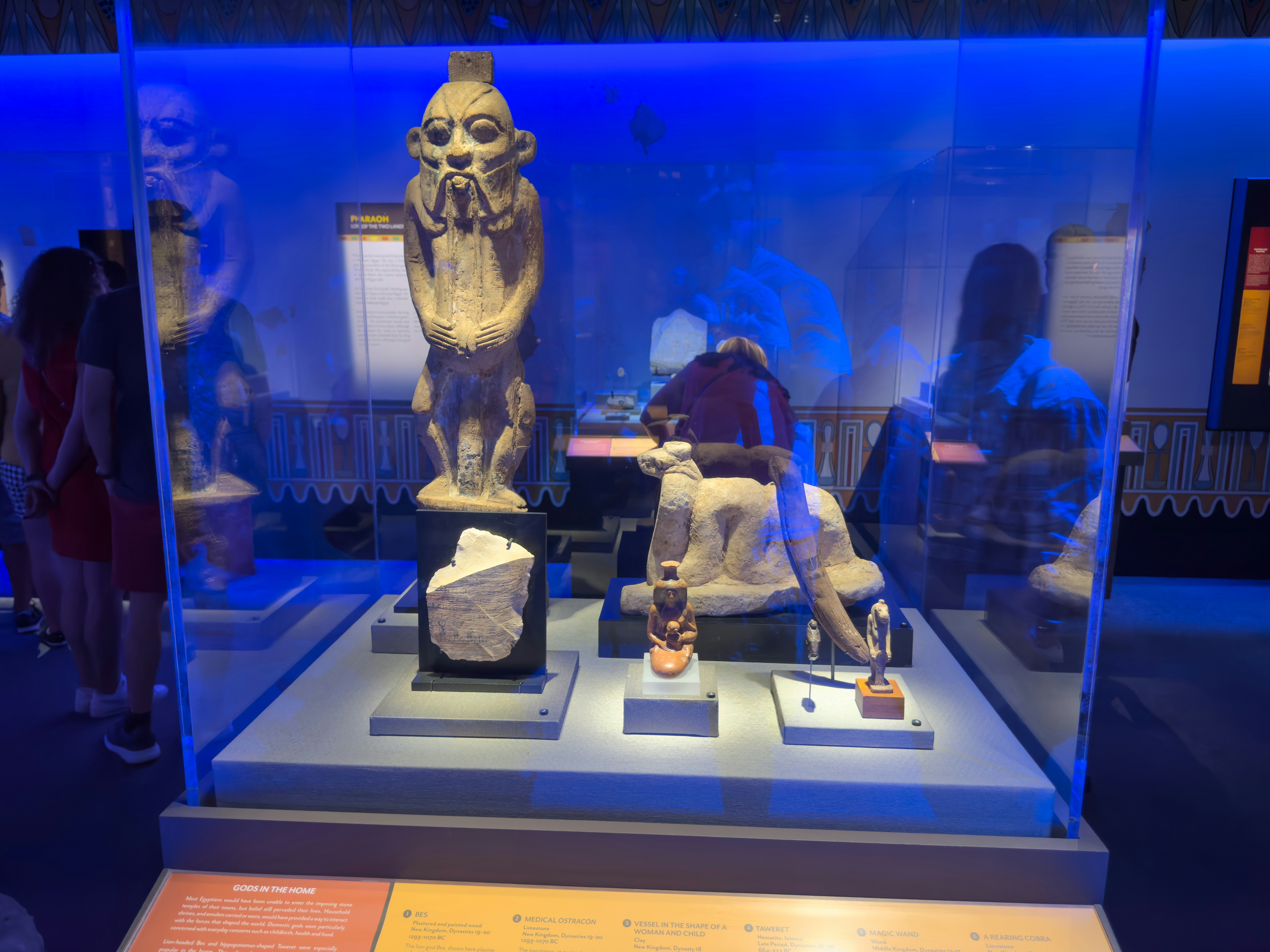 Egyptian ancient weapons and armor displayed in museum, bronze spears and shields, dramatic lighting