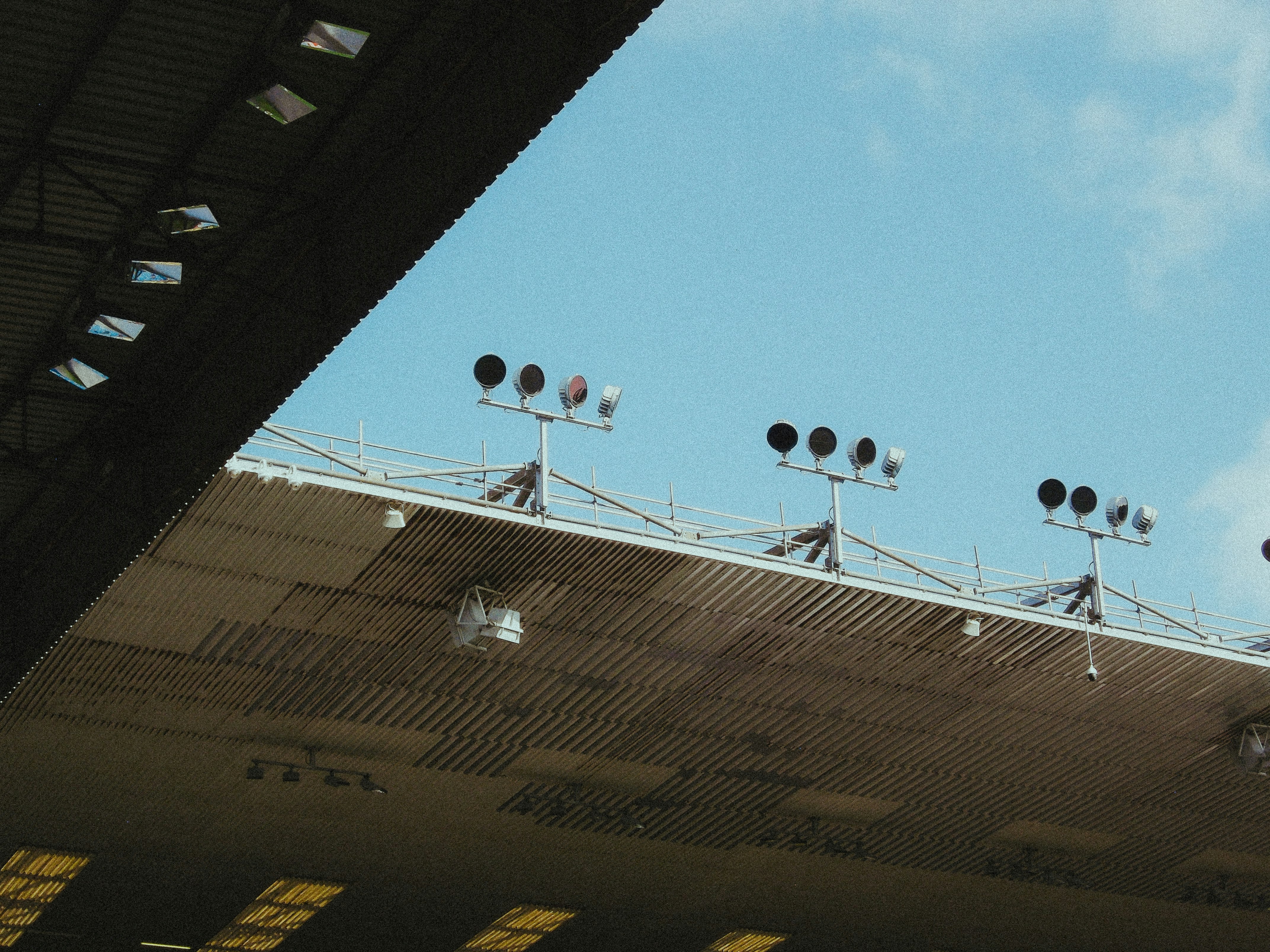 A group of traffic lights on top of a roof